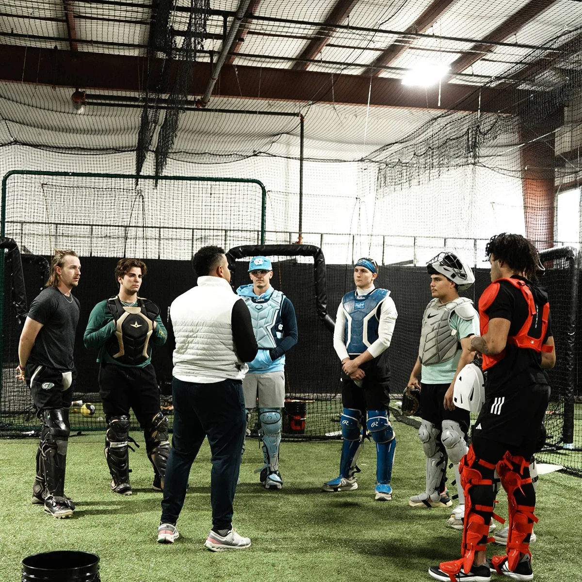 Andrés Ugarte coaching a group of advanced catchers